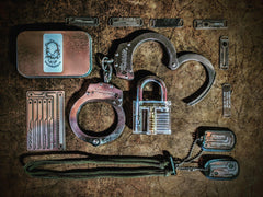 Emergency esacpe and evasion tools on a tactical necklace escape kit. 